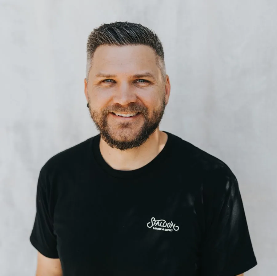 Johannes Klupfel smiling, in a black t-shirt